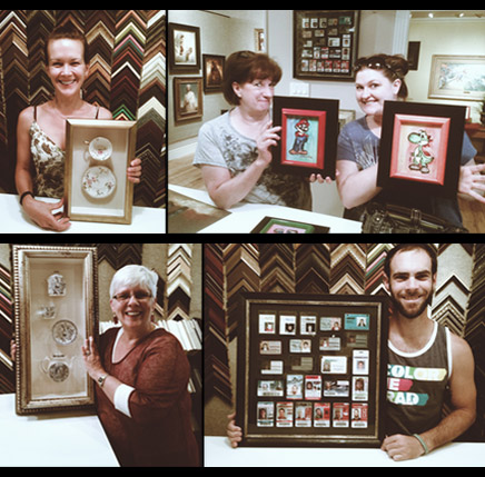 cCustomers holding framed artwork